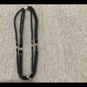 Three strand necklace with 14k gold clasp